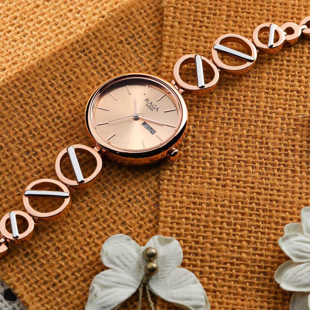 Titan Raga Viva Quartz Analog with Day and Date Rose Gold Dial Two Toned Metal Strap Watch For Women